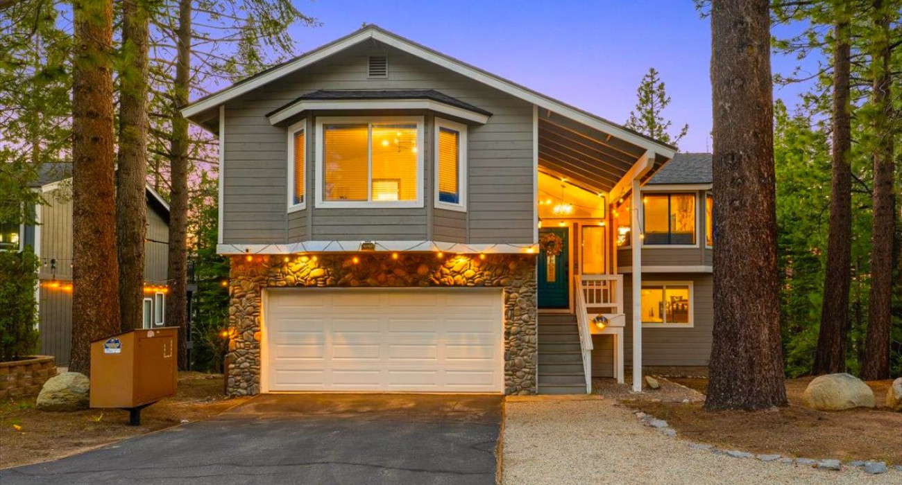 A luxury cabin surrounded by mountain and lake views, perfect for a South Lake Tahoe family summer vacation